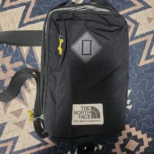 The North Face Black Backpack with Yellow Accents